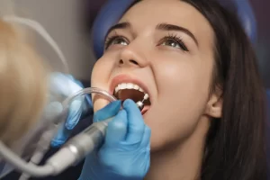 woman in dentist chair receiving preventative care