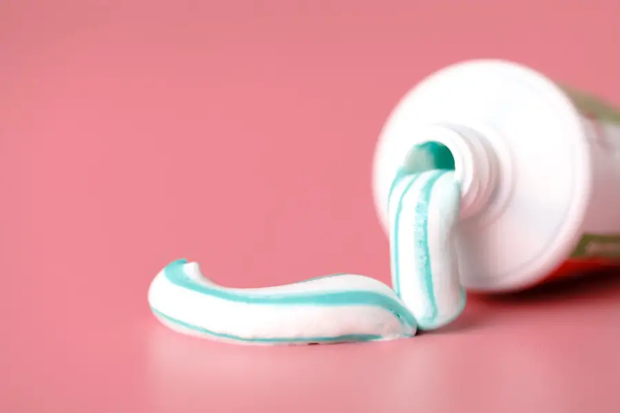 toothpaste coming out of tube